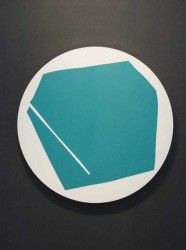This bold, graphic-based painting of an aqua polygon on a round, white panel is rimmed with gold leaf.
