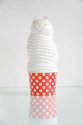 This clever and charming cat sculpture in bright white and red is by the Israel-based artist Benny Katz.
