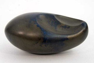 The undulating gentle curves of this sculpture by artist Jana Osterman emulate organic egg shaped forms found in nature.