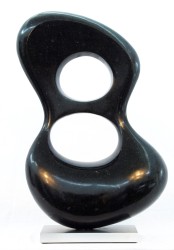 Smooth surfaced, black granite has been engineered into an elegant figure eight shape by sculptor Jeremy Guy.