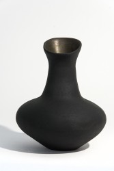 Hand crafted in black basalt clay by ceramicist Loren Kaplan, this small vessel is glazed on the interior.