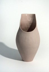 This stained pink stoneware vessel was hand crafted by ceramicist Loren Kaplan.