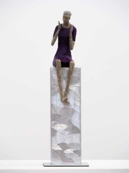 Perched on a silver plinth, a figure in an indigo dress gestures to the viewer in this delightful sculpture by Paul Duval.