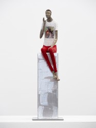 A figure in red and white calls out from his silver leaf perch in this delightful sculpture by Paul Duval.