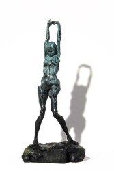 The striking figure of a nude female, arms stretched above her head is the subject of this bronze sculpture by Canadian artist Richard Toscz…