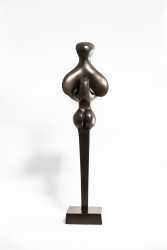 Cast in bronze, this elegant abstract sculpture of a figure is by Sorel Etrog.