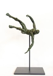A male figure with arms outstretched twists as he falls sideways towards the the ground in this green patinated bronze sculpture.